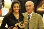 Nicola Bandini, Chairman of Antiga Arabia, poses with Brazilian testimonial Maria Do Carmo Vasconcelos Silveira at the Miniature Arsenal booth.