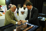H.H. Sheikh Mubarak Bin Nahyan Bin Mubarak Al Nahyan tries the trigger of a Miniature Arsenal half size Kalashnikov.